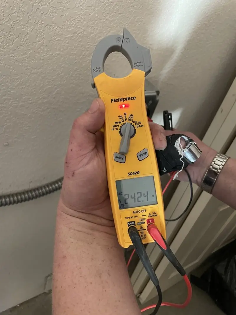 Voltage testing with clamp meter during Generator Installation in Greenwich